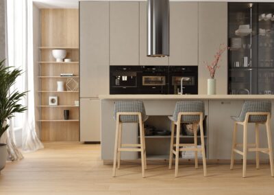 A modern kitchen with wooden cabinets and stools.